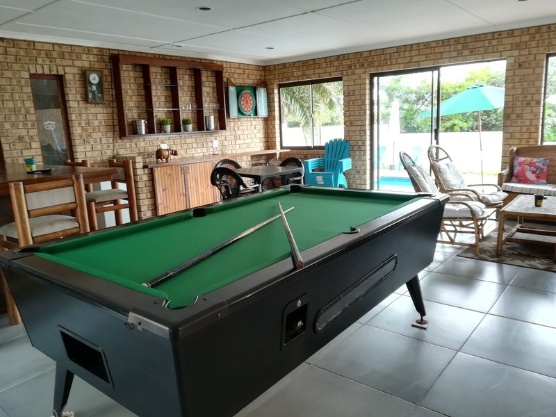 Rockview Guest House Entertainment room with large screen TV, pool table and seating